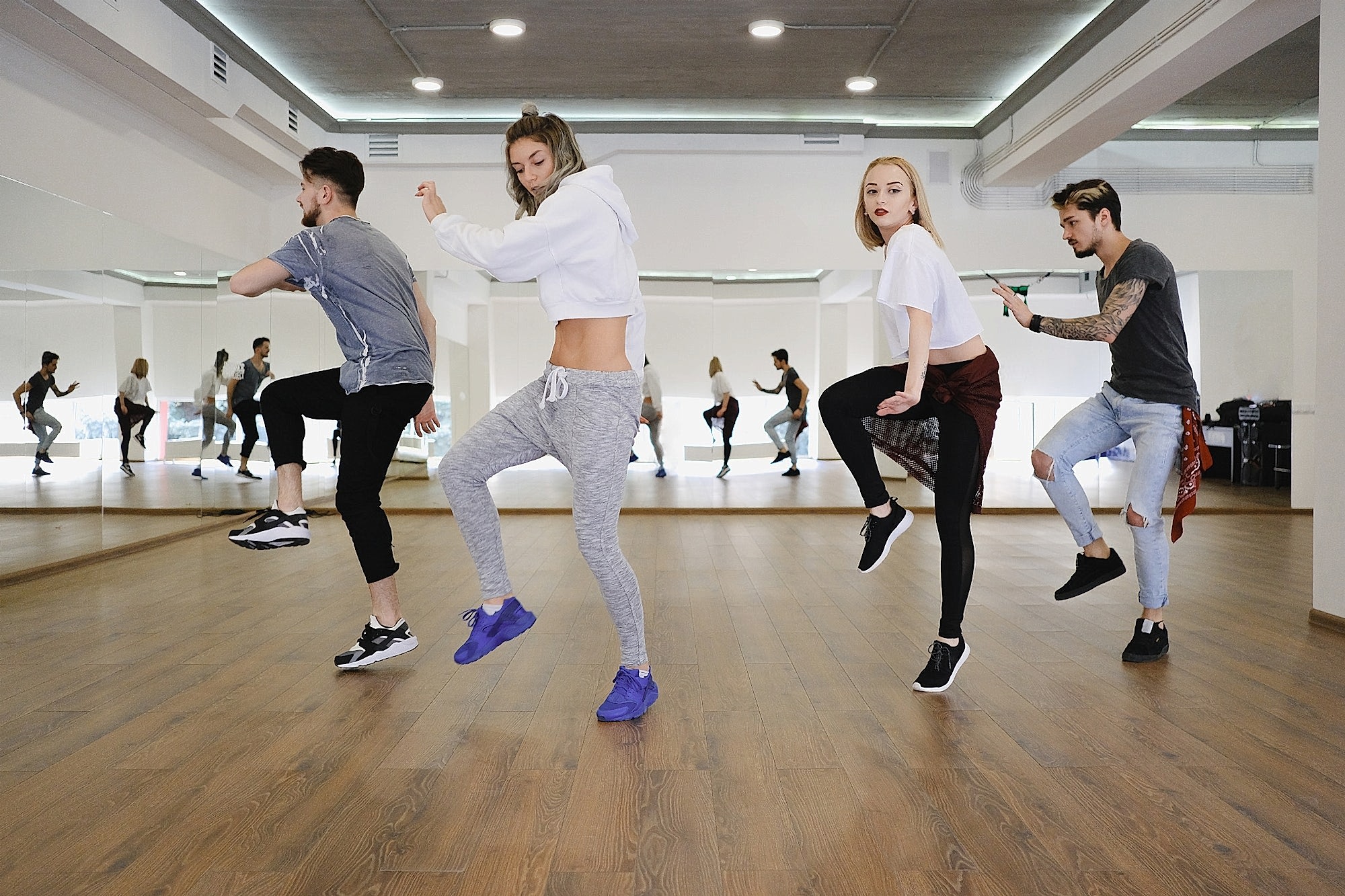 group of young modern dancers dancing in the studio 1